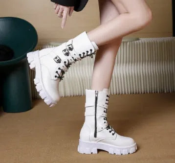 Black women's mid-calf knight boots with metal buckle straps and a side zipper on a round toe.