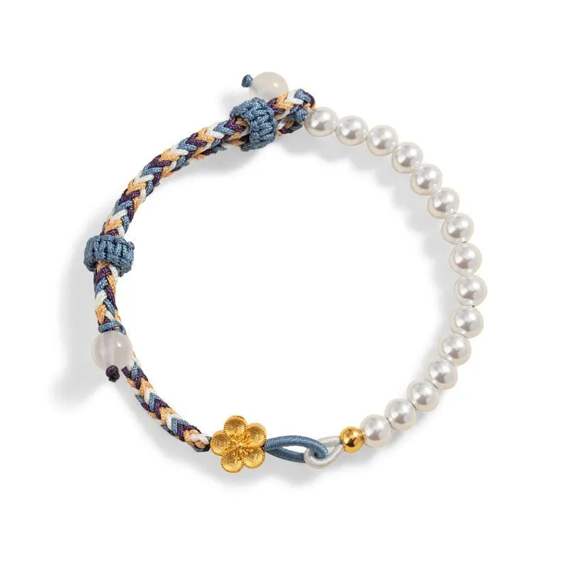 Peach coloured cord carrying strap with electroplated sterling silver chalcedony bead and Chinese flower weaving design