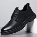 Men's black leather sneakers with rubber sole and sewing line detailing on two-layer cowhide upper
