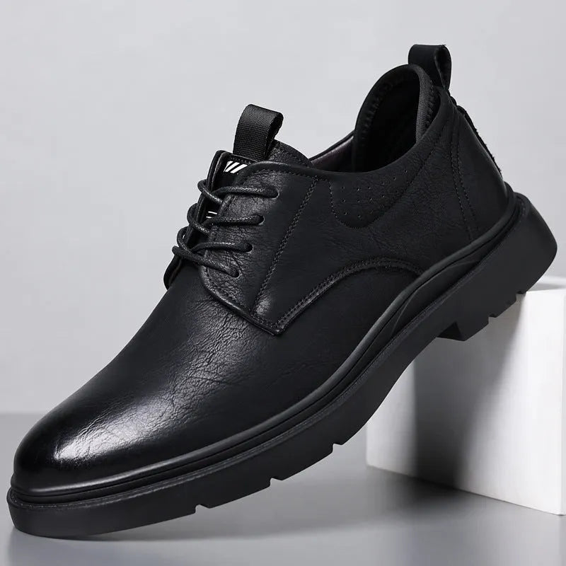 Men's black leather sneakers with rubber sole and sewing line detailing on two-layer cowhide upper