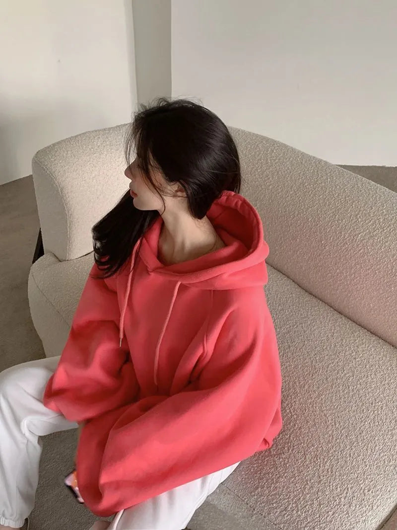 Watermelon red sleeveless Mulberry Silk hooded sweater on a hanger, showing loose fit and solid colour.