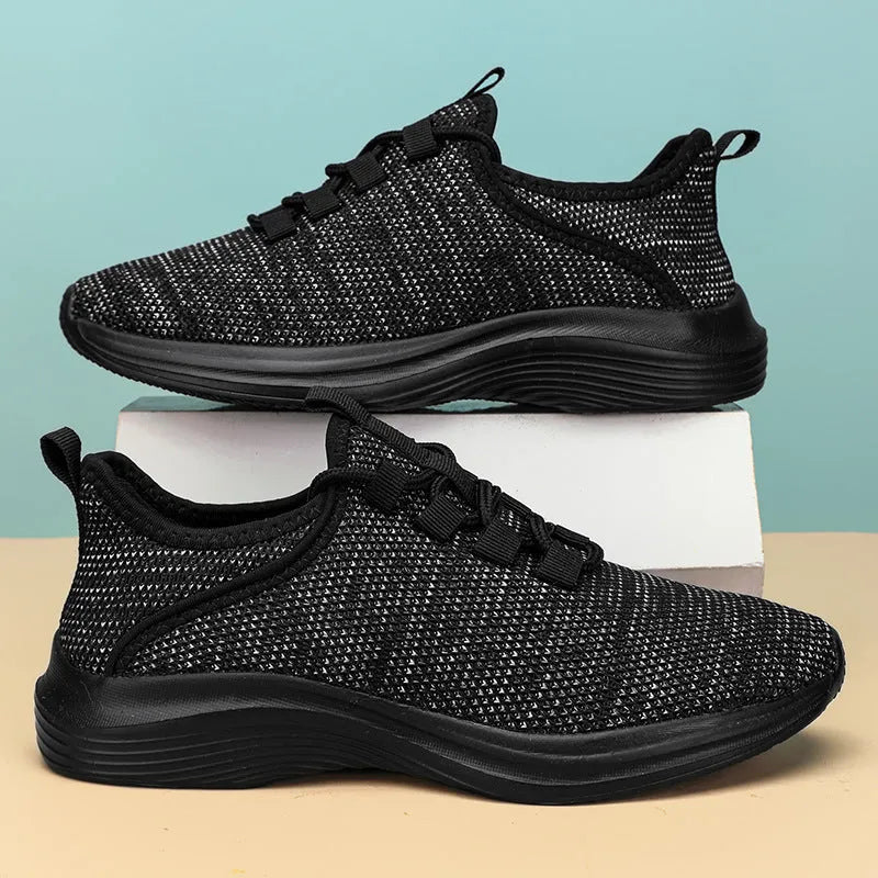 Women's breathable flyknit casual sneaker in black with lace-up front and low-top design