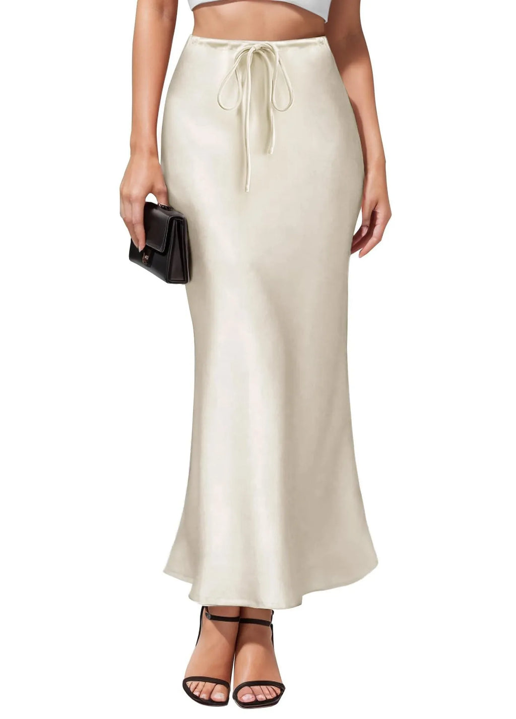 Women's high-waisted asymmetric satin skirt in black on a hanger, showing irregular hem detail.