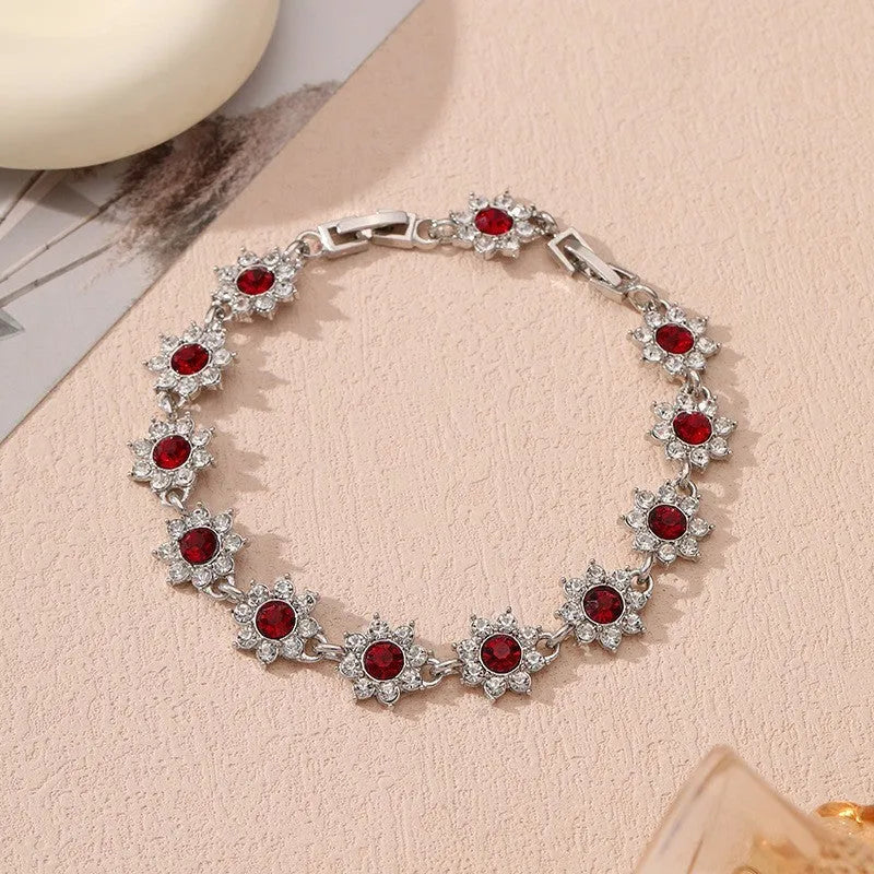 Flower-shaped zinc alloy bracelet with electroplated finish and coloured gem accents