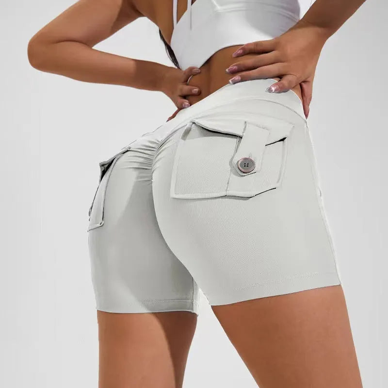 Women's high-waist fitness shorts in quick-dry nylon with side pockets, shown in Electric Blue.
