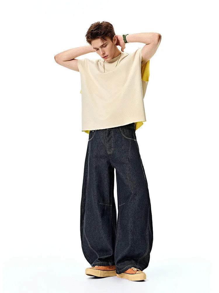 Men's wide-leg denim trousers in original cow colour, showing relaxed fit and mid-waist design.