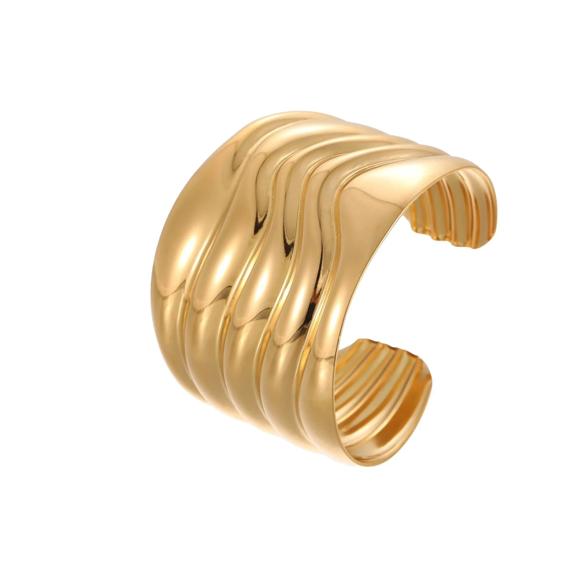 Women's stainless steel bracelet with 18K gold plating featuring geometric wave design and exaggerated wide band
