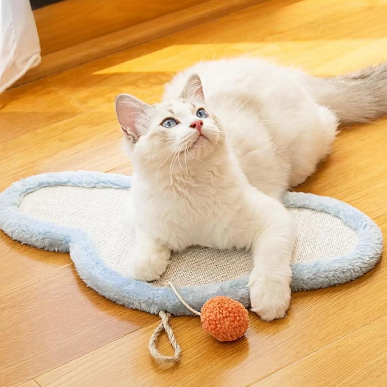 White cat scratching mat with sleeping cat cartoon design made from natural sisal