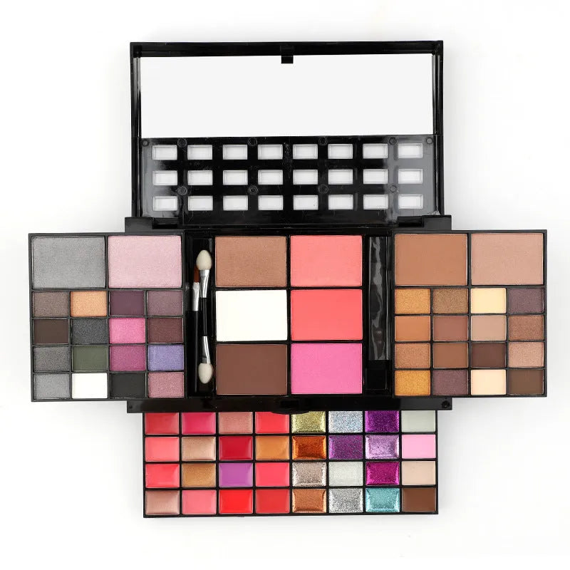 74 colour makeup palette open showing eyeshadows, lip glosses, and face powders with a mirror and brushes.