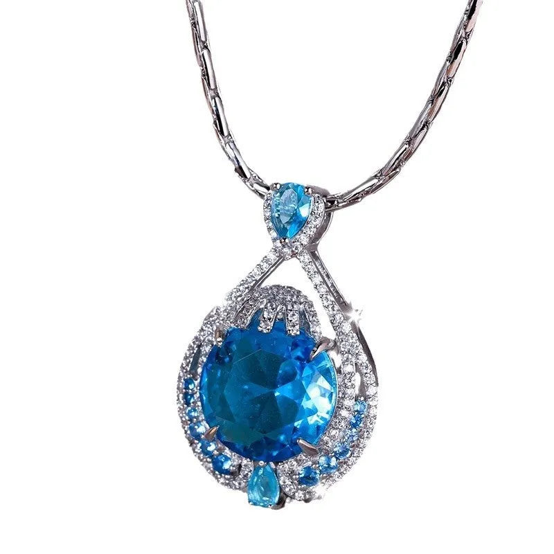 Blue fireworks cut gem geometric pendant necklace with water wave chain on woman