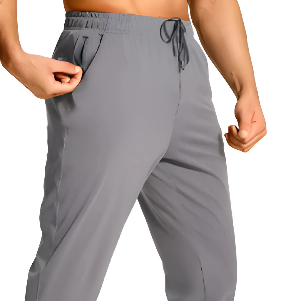 Men's loose fit polyester casual trousers in solid colour with relaxed silhouette