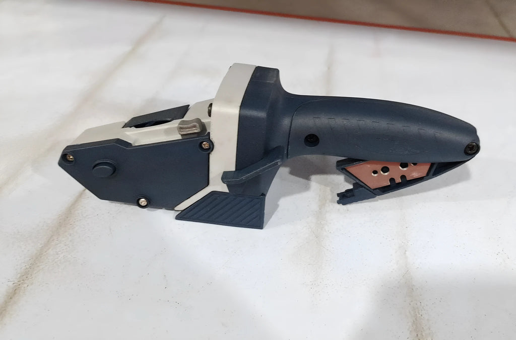 Blue multifunctional woodworking cutter with aluminium alloy body and measurement scale for dust-free board cutting.