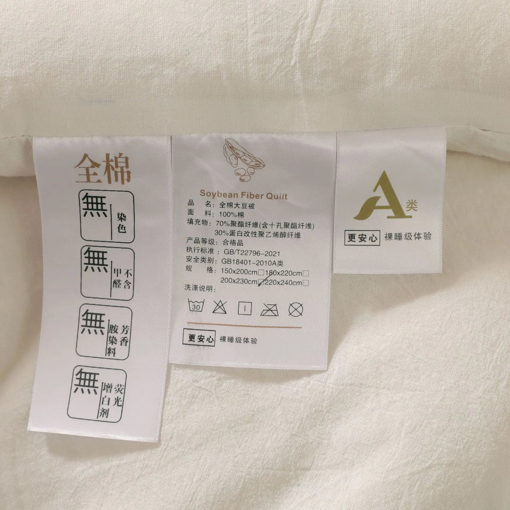 Soybean fibre quilt with pure cotton cover in white, grey, or pink jade, shown in various sizes on a bed.