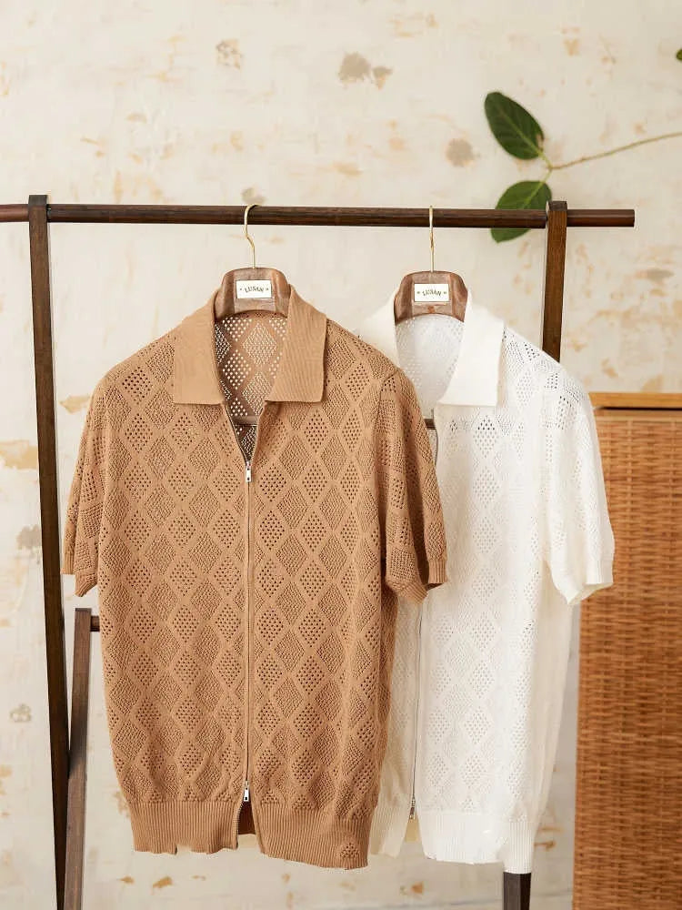 Light brown cotton cardigan with front zipper and short sleeves laid flat.