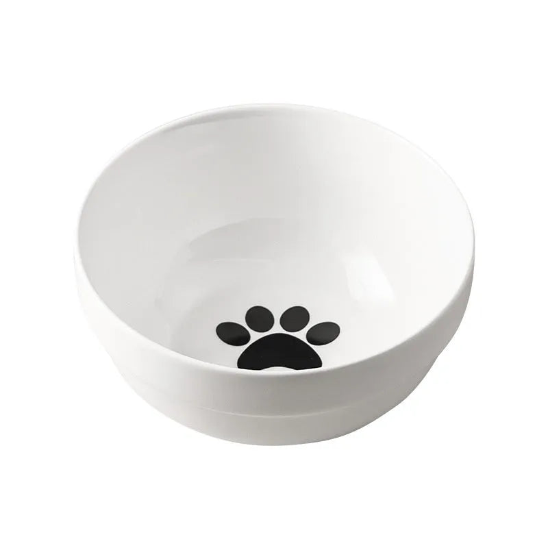 White ceramic cat bowl with decorative iron frame in cat footprints pattern