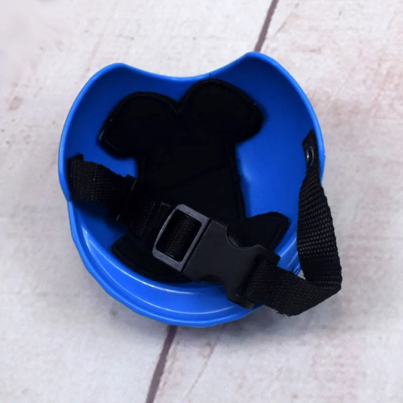 A pink plastic dog helmet cap showing its rigid shape and solid colour, sized for a small dog.