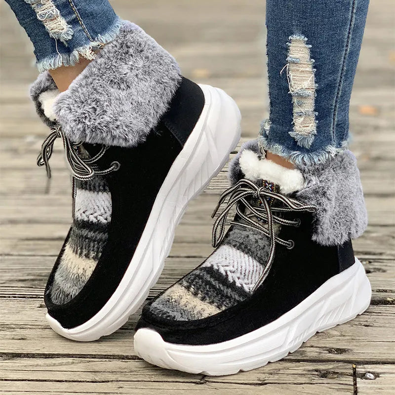 Beige women's lace-up suede snow boots with plush lining and a thick rubber sole.