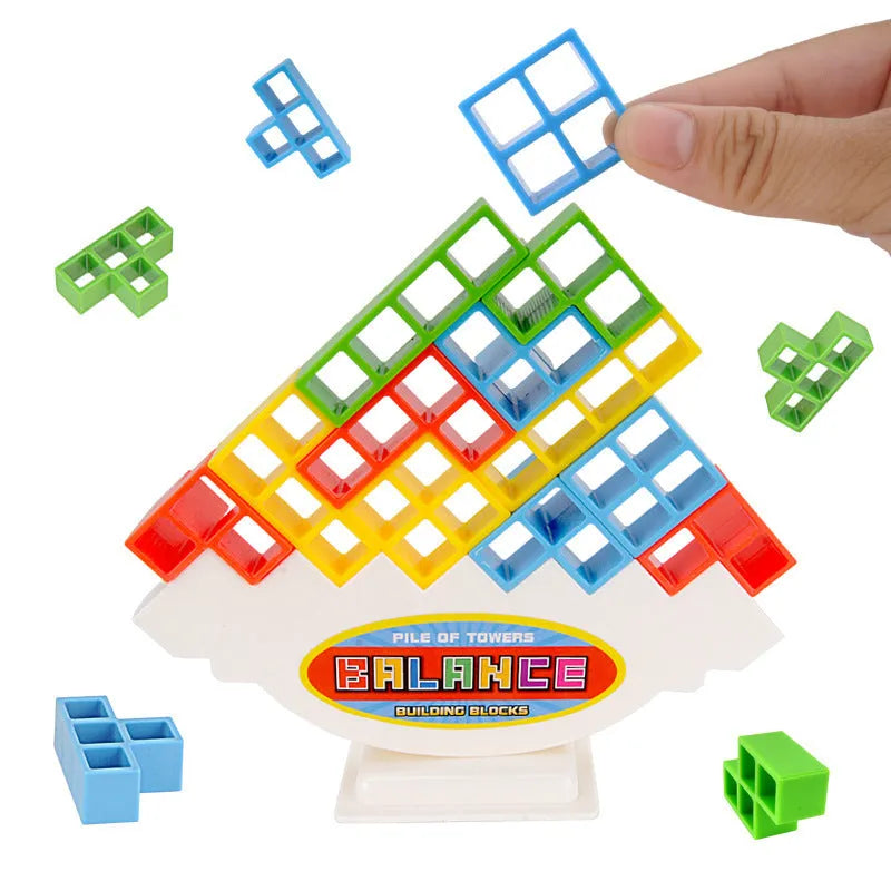 Plastic balance stacking board game with colourful blocks, chassis, and base on table