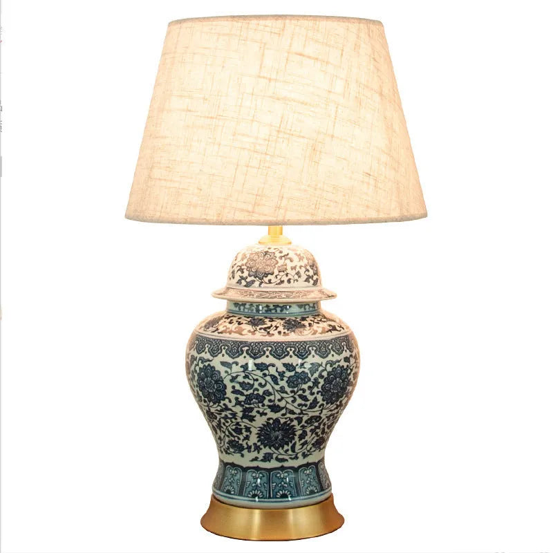 Blue and white porcelain Chinese style table lamp with ceramic base and cloth shade.
