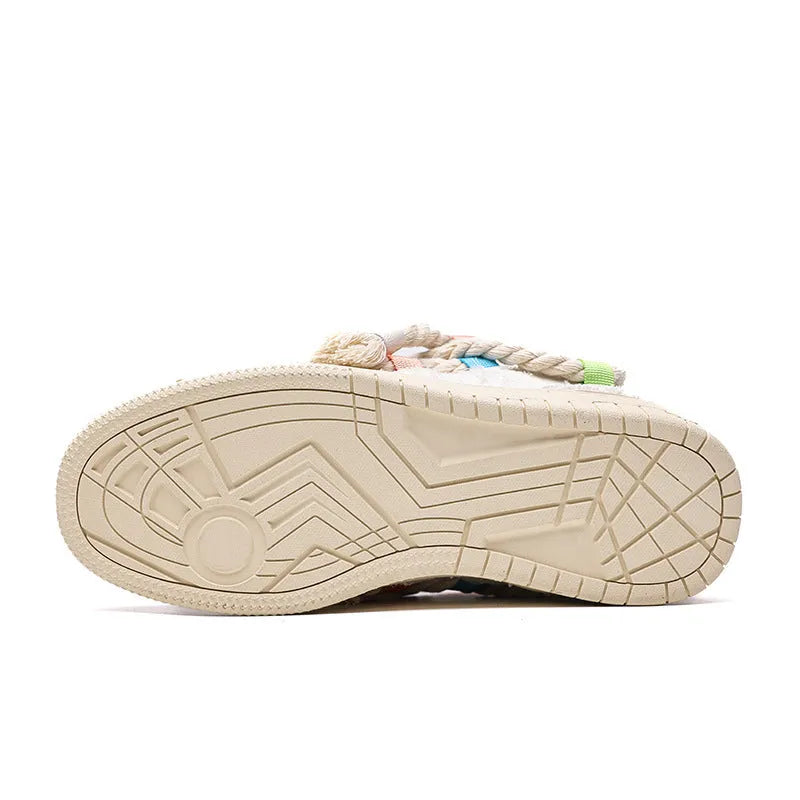 Creamy white old damage lace-up retro skateboard shoes with low-top round toe and platform sole.