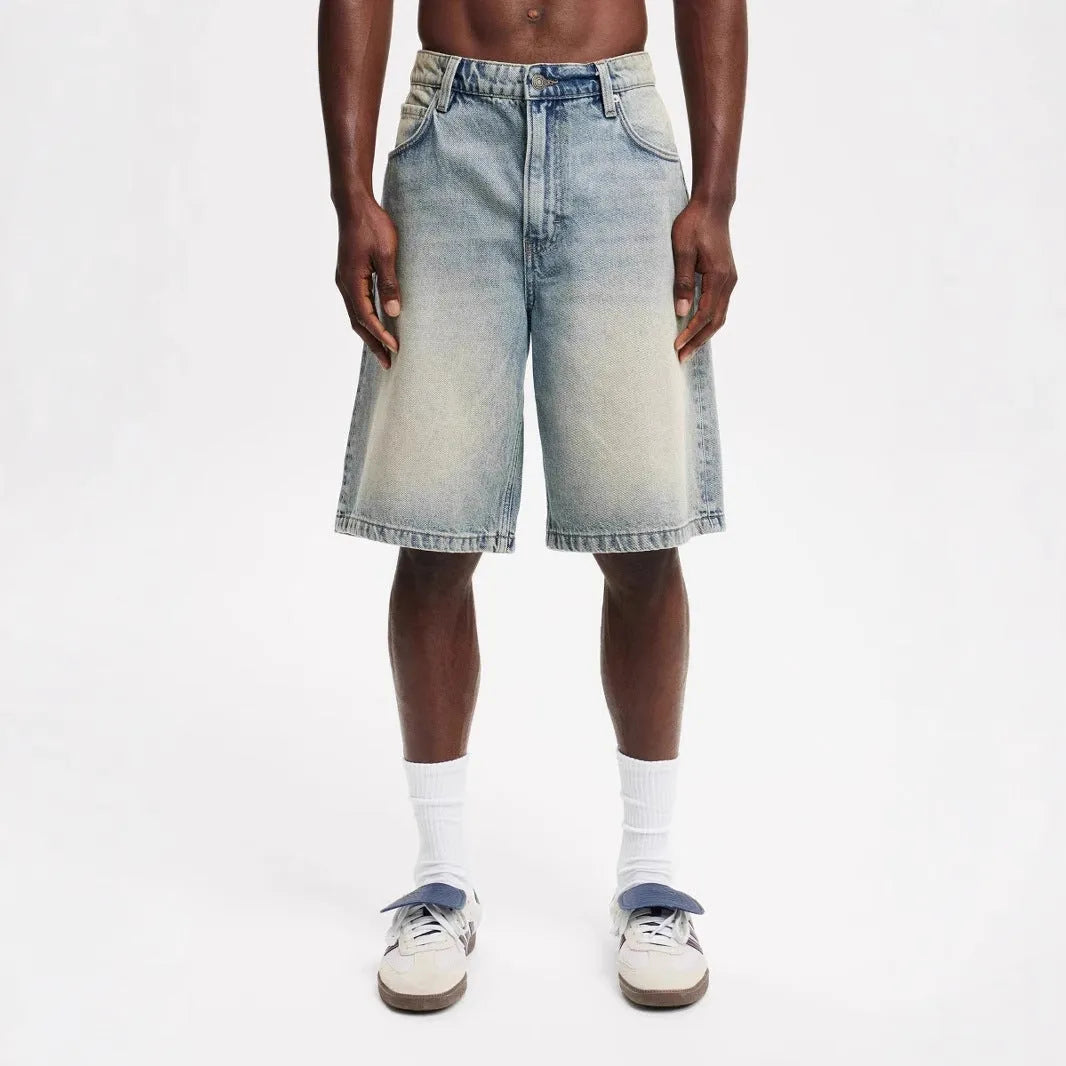 Men's loose fit straight leg jeans in light blue, black, and grey cotton denim