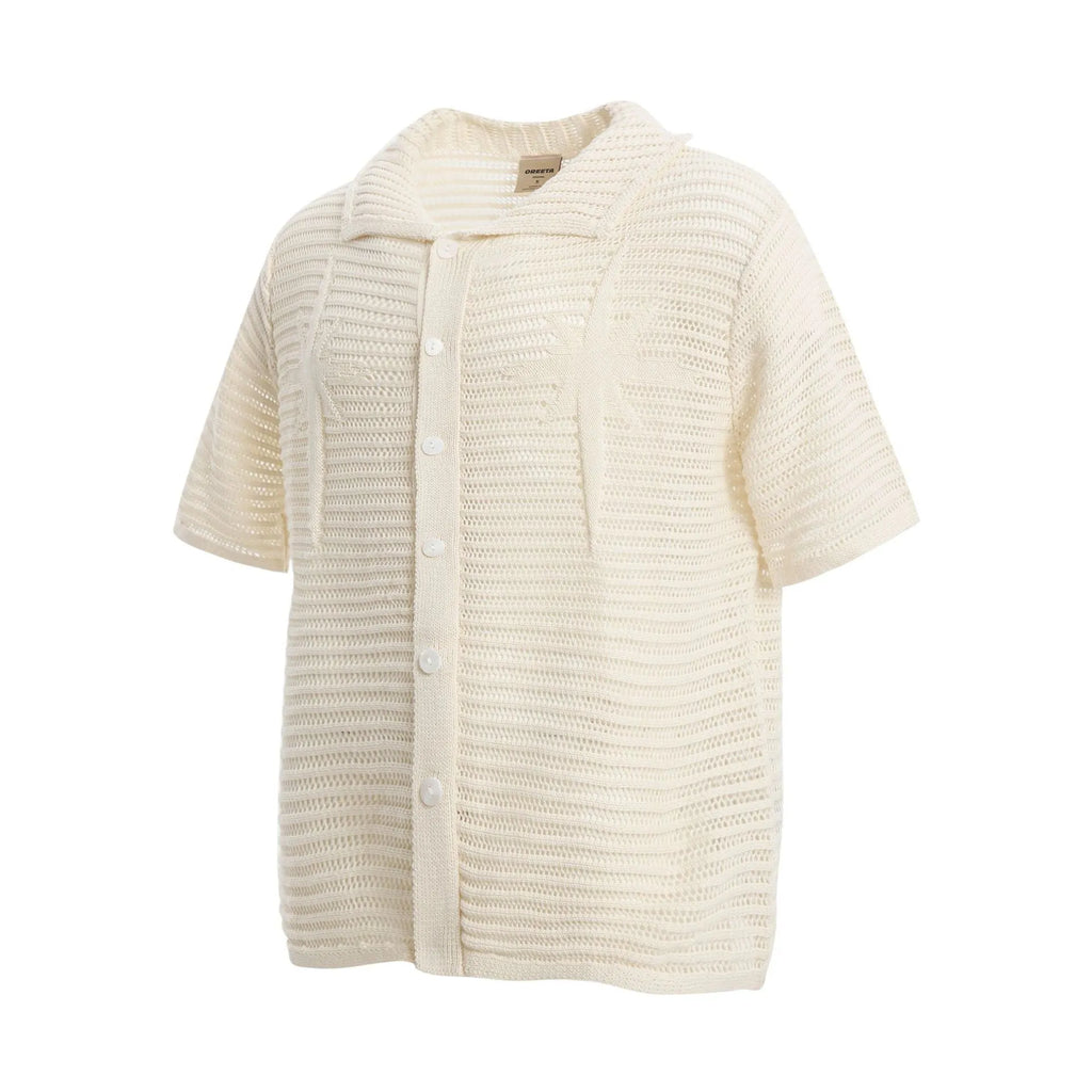 American retro loose design short sleeve cotton shirt in apricot and black colours on a hanger.