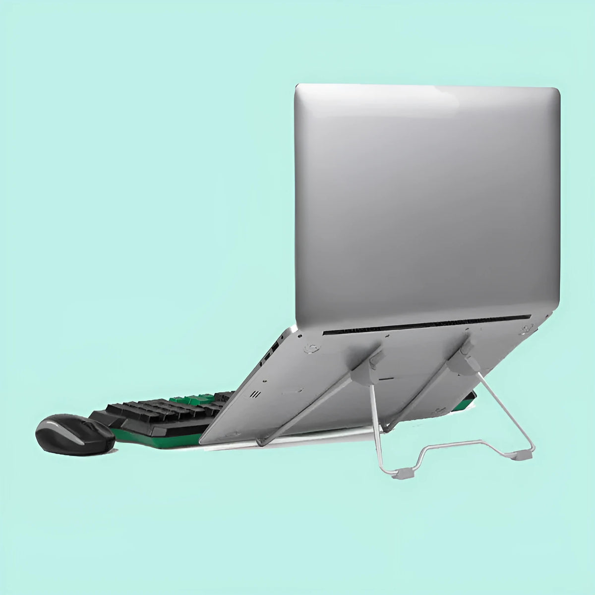 Grey aluminium alloy and plastic mobile phone stand laptop stand on a desk