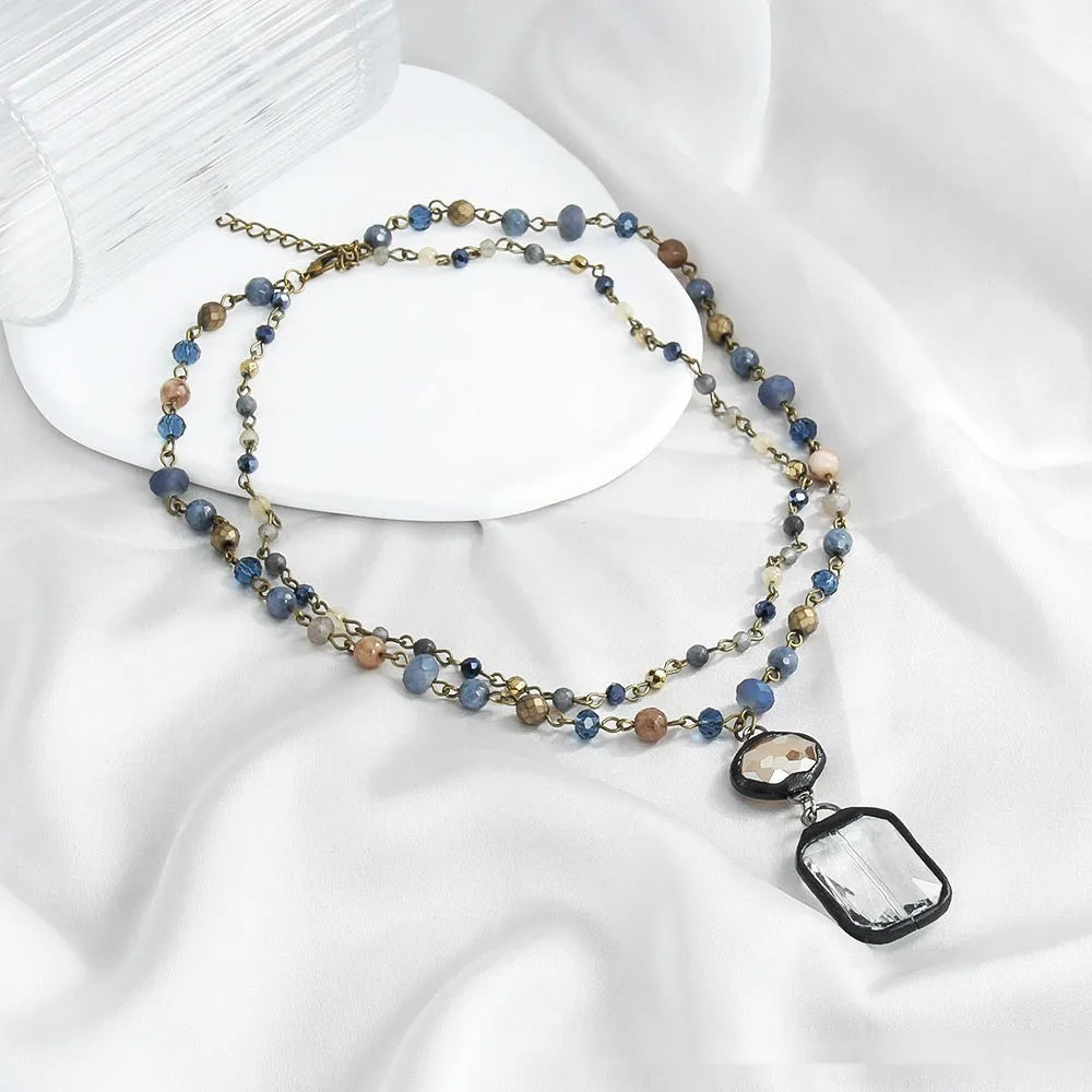 Two-layer tribal necklace with glass pendant and adjustable 31-40cm chain in beige colour