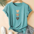Women's printed cotton round neck t-shirt in blue on a hanger, showing art retro short sleeve design.