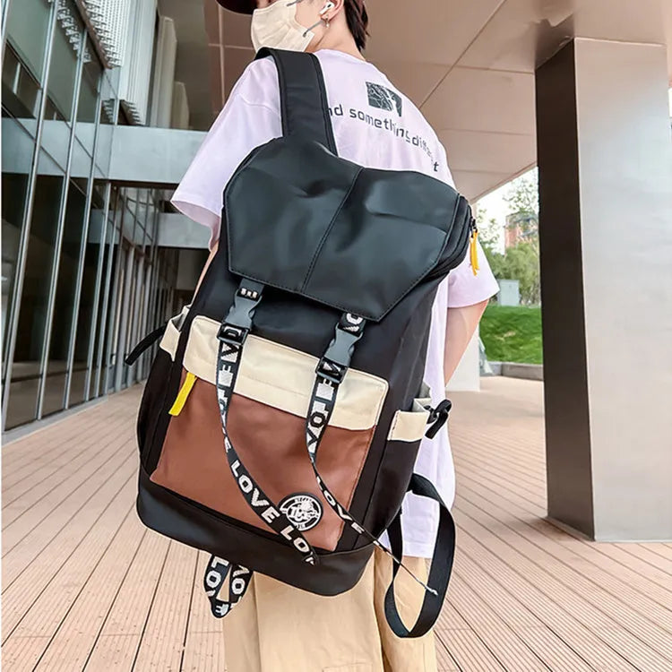 Oxford cloth backpack in black, green or red with 32cm width and 46cm height dimensions