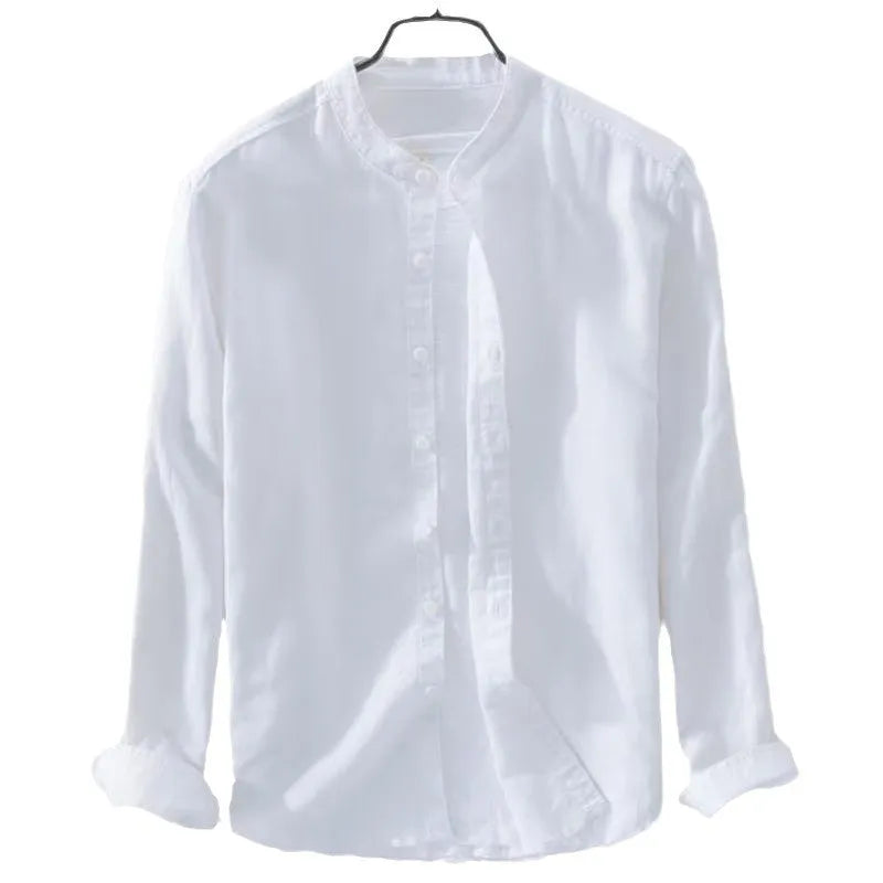 Man's loose fitting long sleeve linen shirt in a solid colour on a hanger.