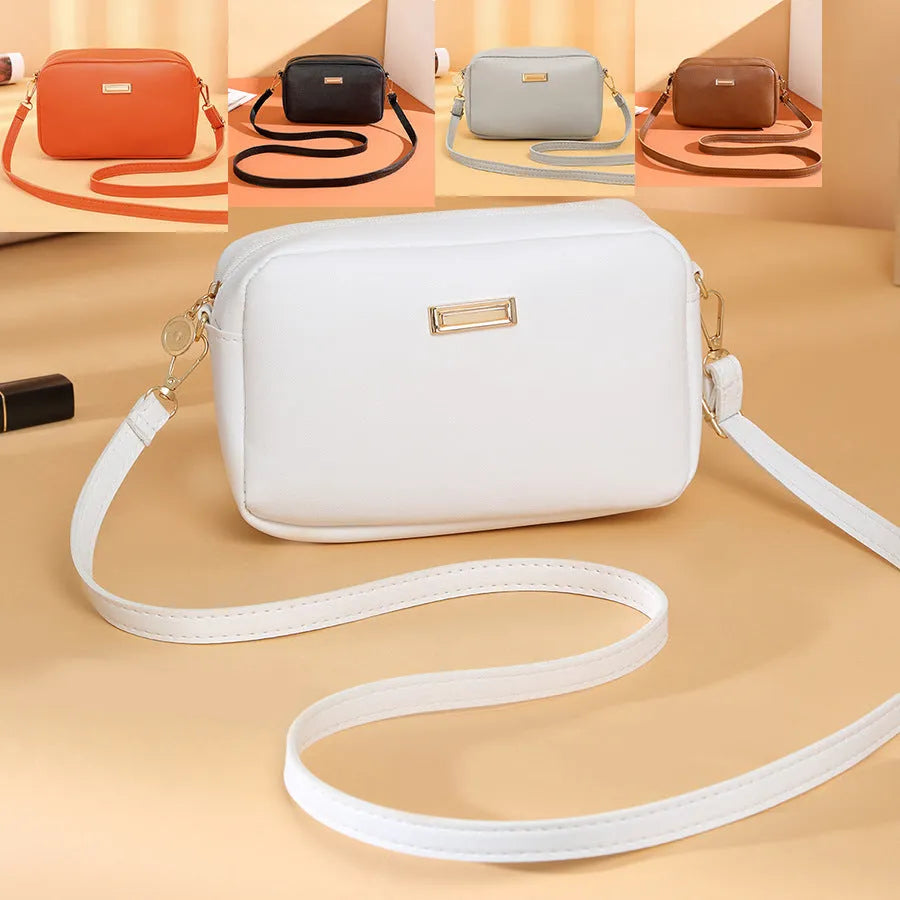 Women's solid colour PU shoulder bag with three-dimensional pocket in urban simplicity design