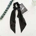 Long ribbon floral hair tie in spring dark green cloth with decorative ring