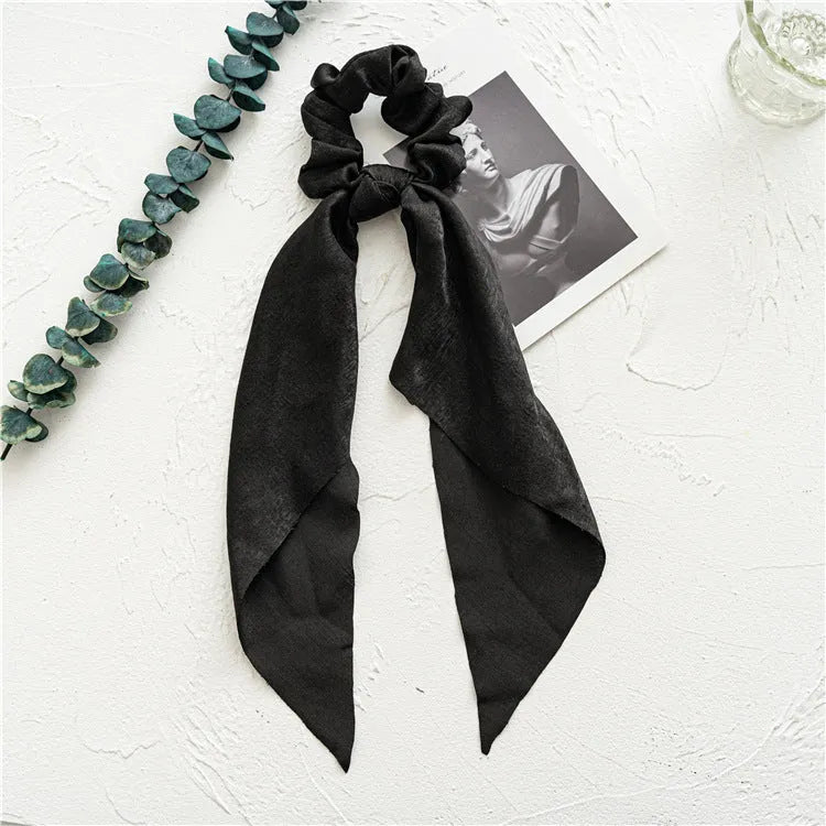 Long ribbon floral hair tie in spring dark green cloth with decorative ring