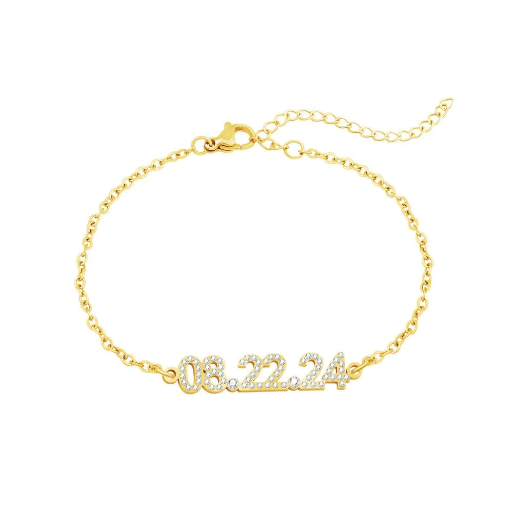 Stainless steel digital bracelet or necklace with diamond-set bezel showing time display, in gold, rose gold, or steel finish.