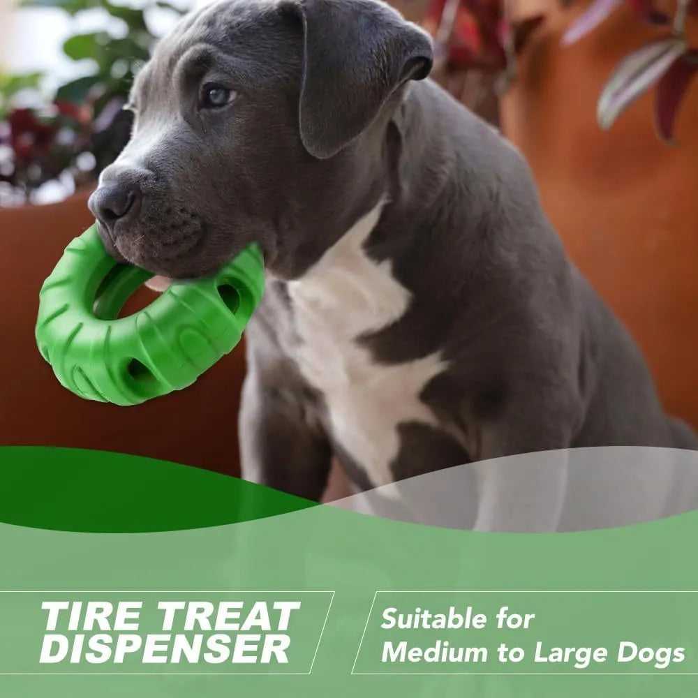 Beef-flavoured red rubber tyre dog chew toy with oval openings for treat dispensing