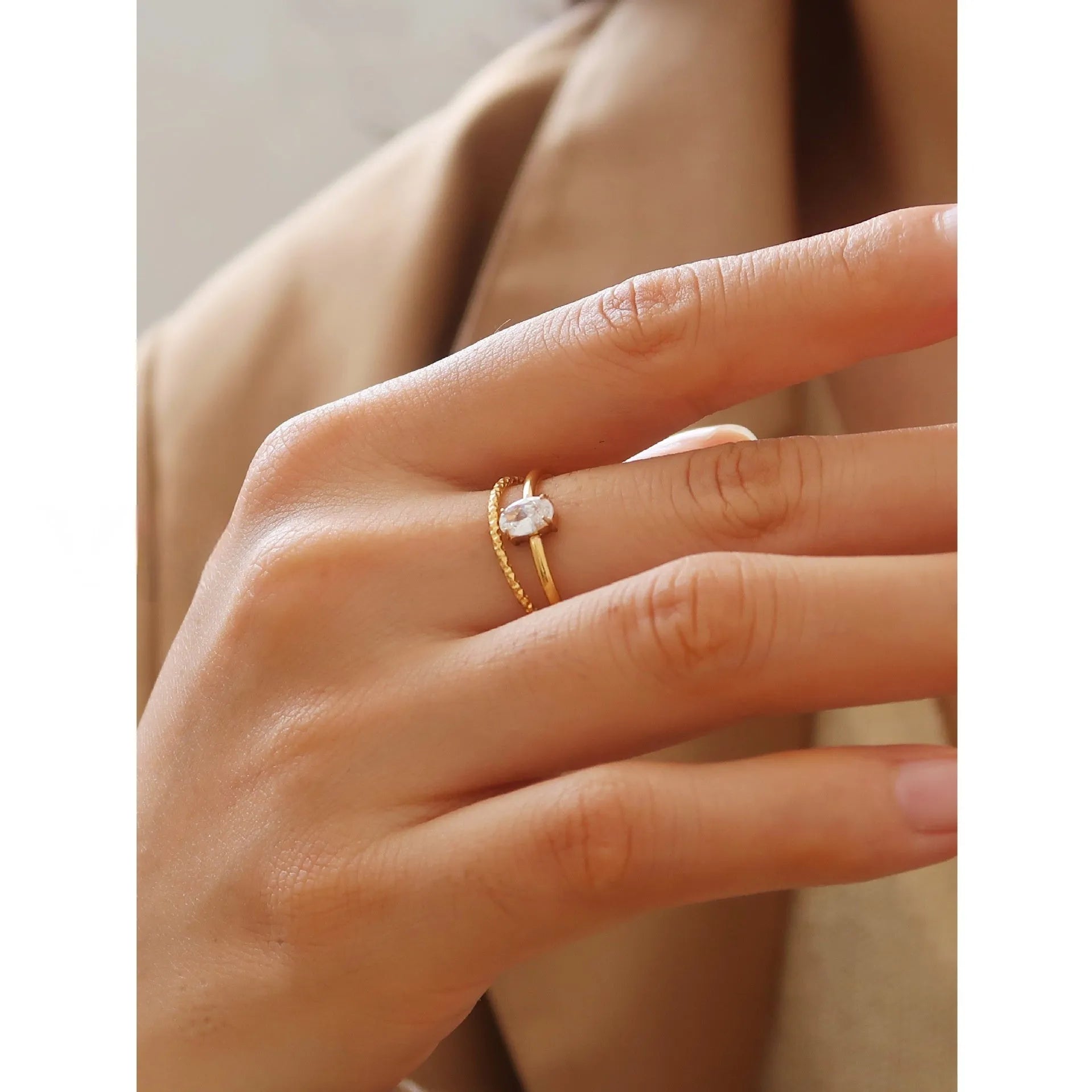 Golden electroplated stainless steel ring in love heart and oval shapes for women.