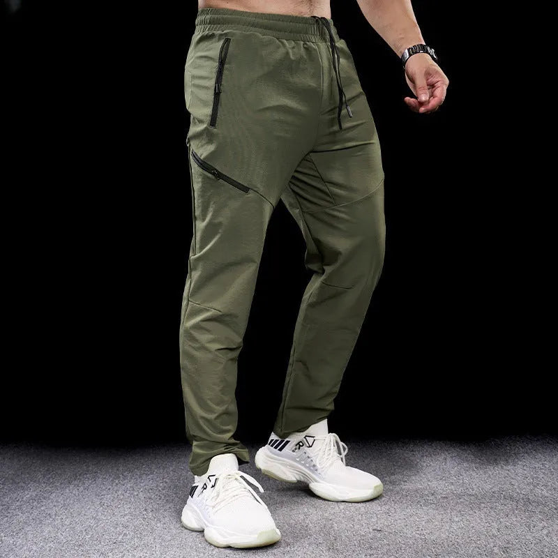 Men's waterproof quick-dry nylon workout trousers in multiple colours on a size chart.