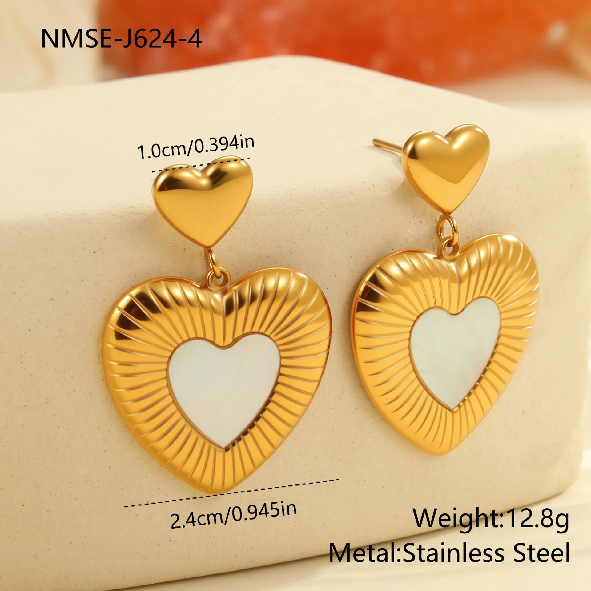Gold electroplated heart-shaped stainless steel earrings for women with love-themed design