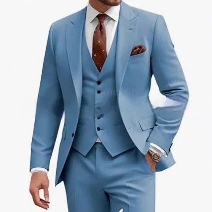 Man wearing a bright red slim fit three-piece suit with waistcoat, suitable for a wedding or business event.