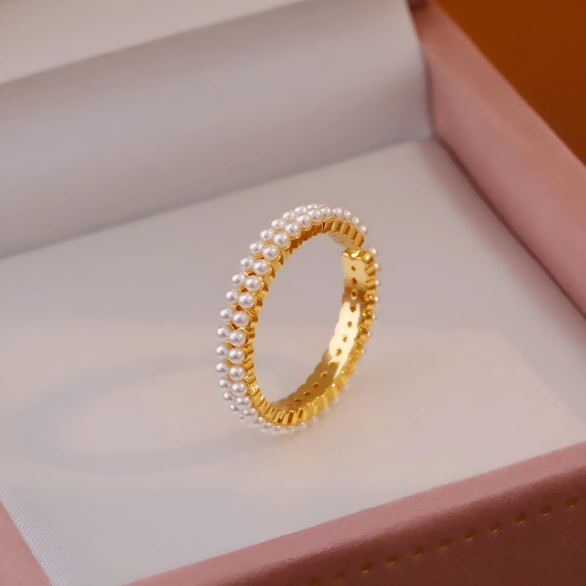 Geometric gold open mouth women's ring with round elements on female hand