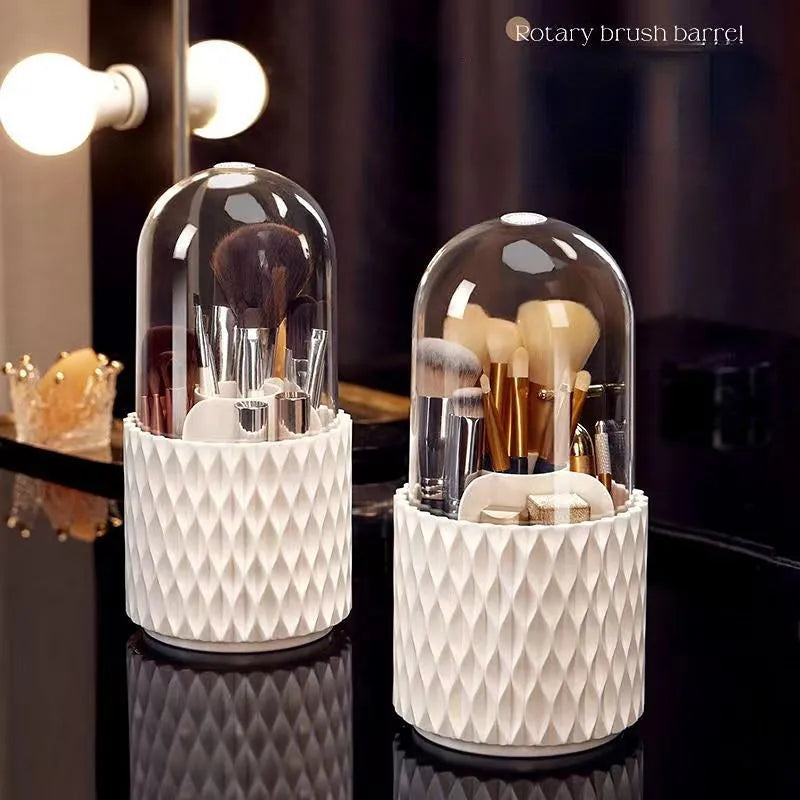 White transparent acrylic makeup brush holder with lid on a desktop, showing rotating base.