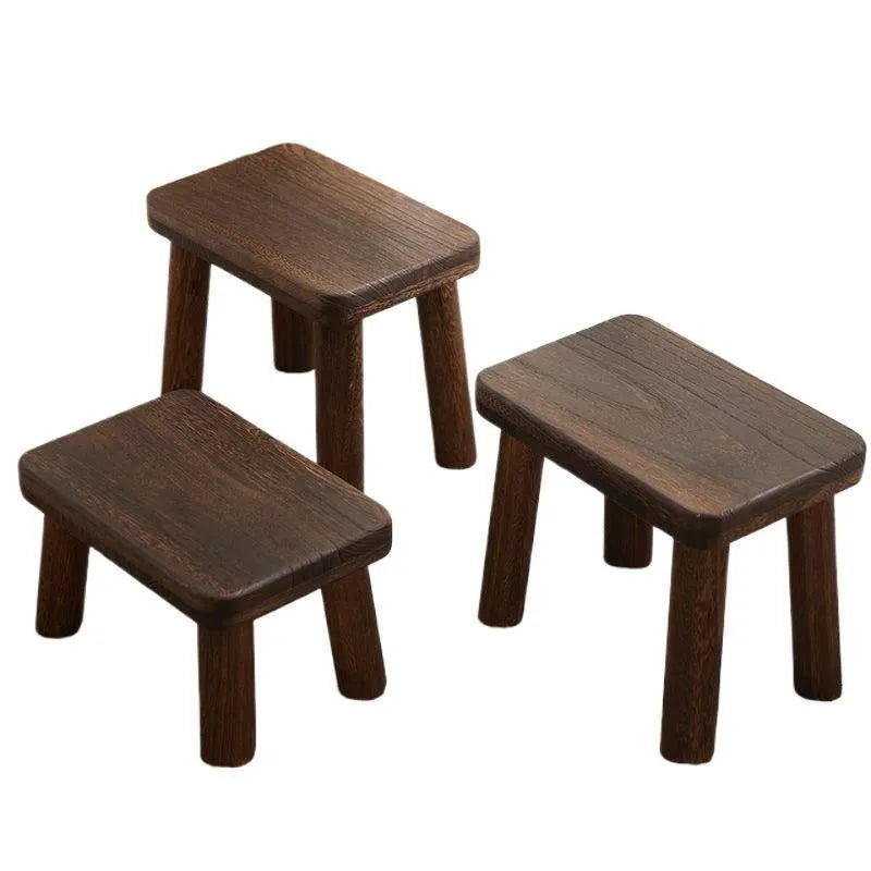 Solid wood household changing stool with a distressed wooden finish.