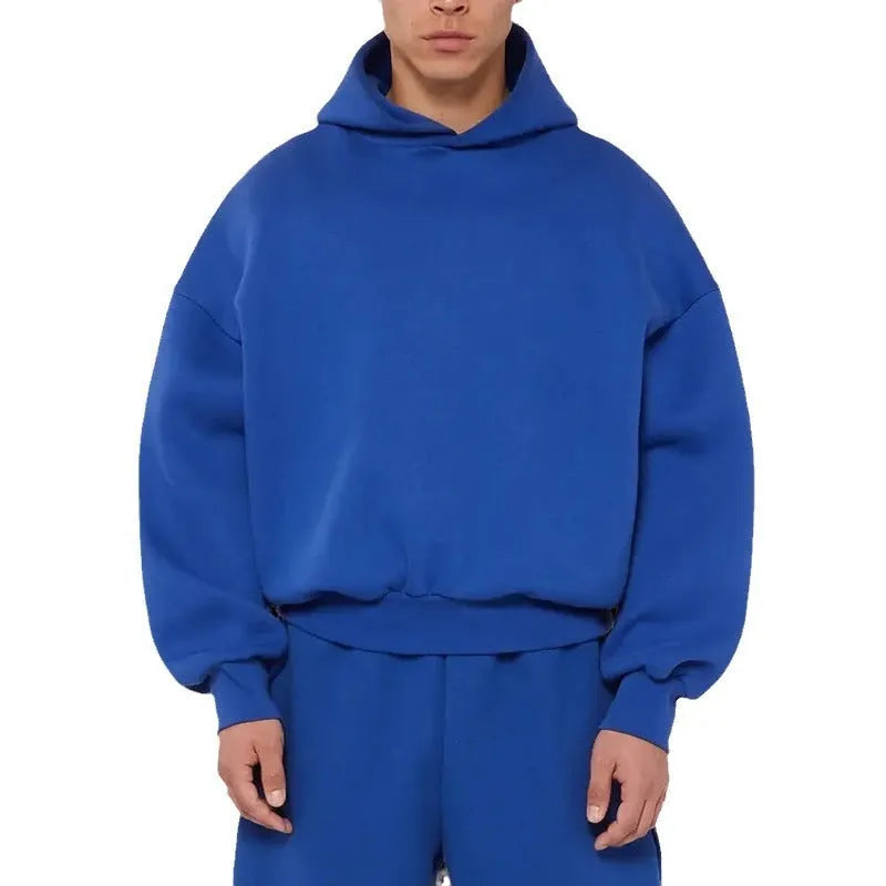 Man wearing a solid colour fleece-lined cotton pullover hoodie with a wool lining.