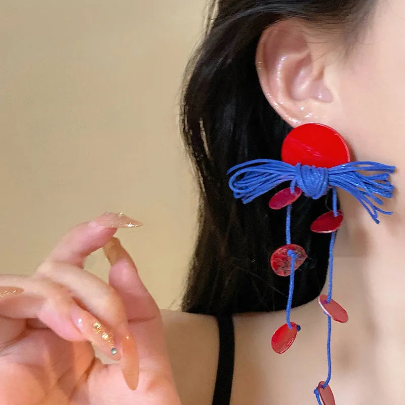 Women's cloth geometry earrings with blue resin flower detail on silver needle, manual craft construction