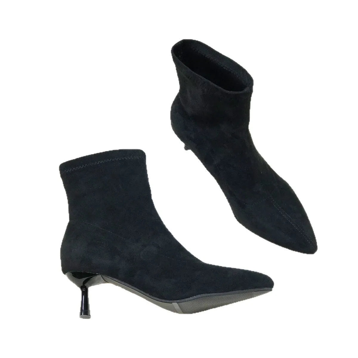 Black pointed toe women's ankle boots with stiletto heel on a plain background