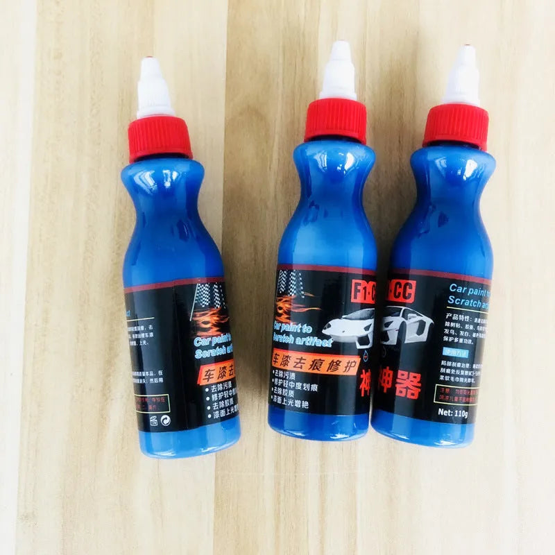 Small blue car scratch repair applicator tool with wiping sponge and repair agent bottle