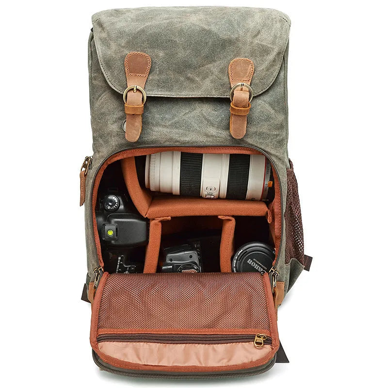 Khaki coloured canvas DSLR camera backpack with adjustable straps shown front-on.