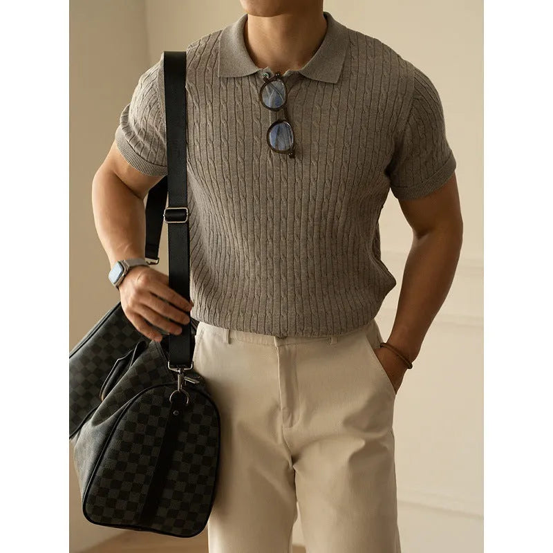 Men's khaki short sleeve business casual top on a hanger.