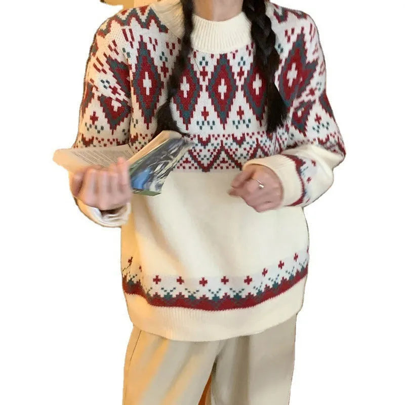 Red and white striped loose retro pullover knitted top with long sleeves on a hanger.